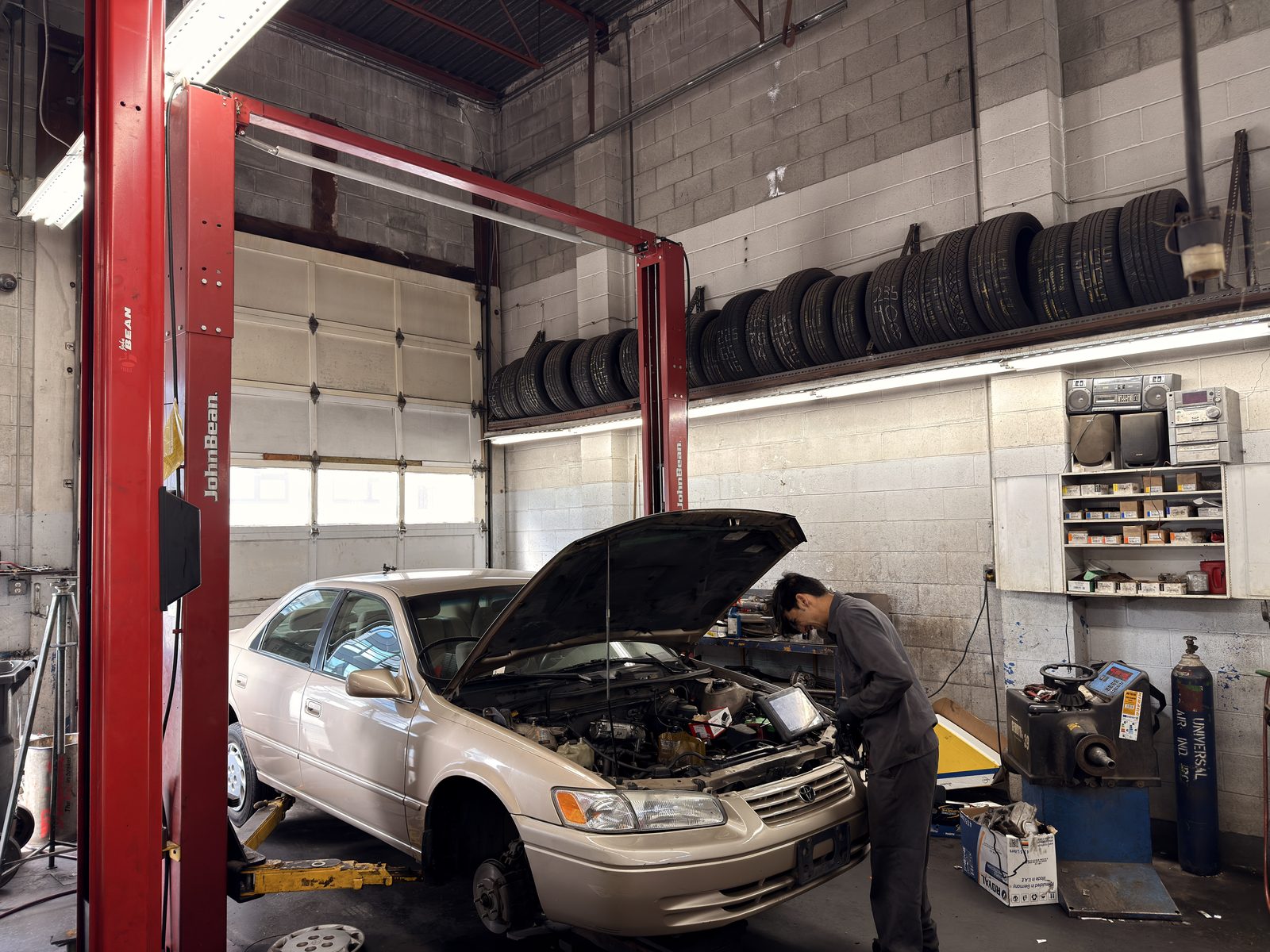 Mechanics working in the Imperial Street Auto Repair bays